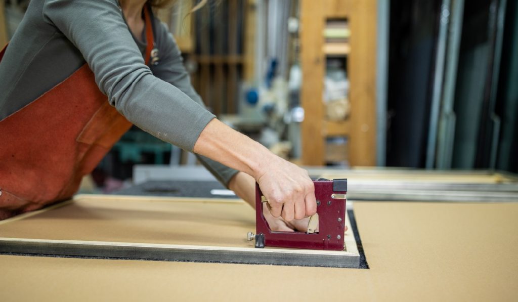 Save Some Money by Revamping Your Dining Room Chairs with a heavy duty staple gun
