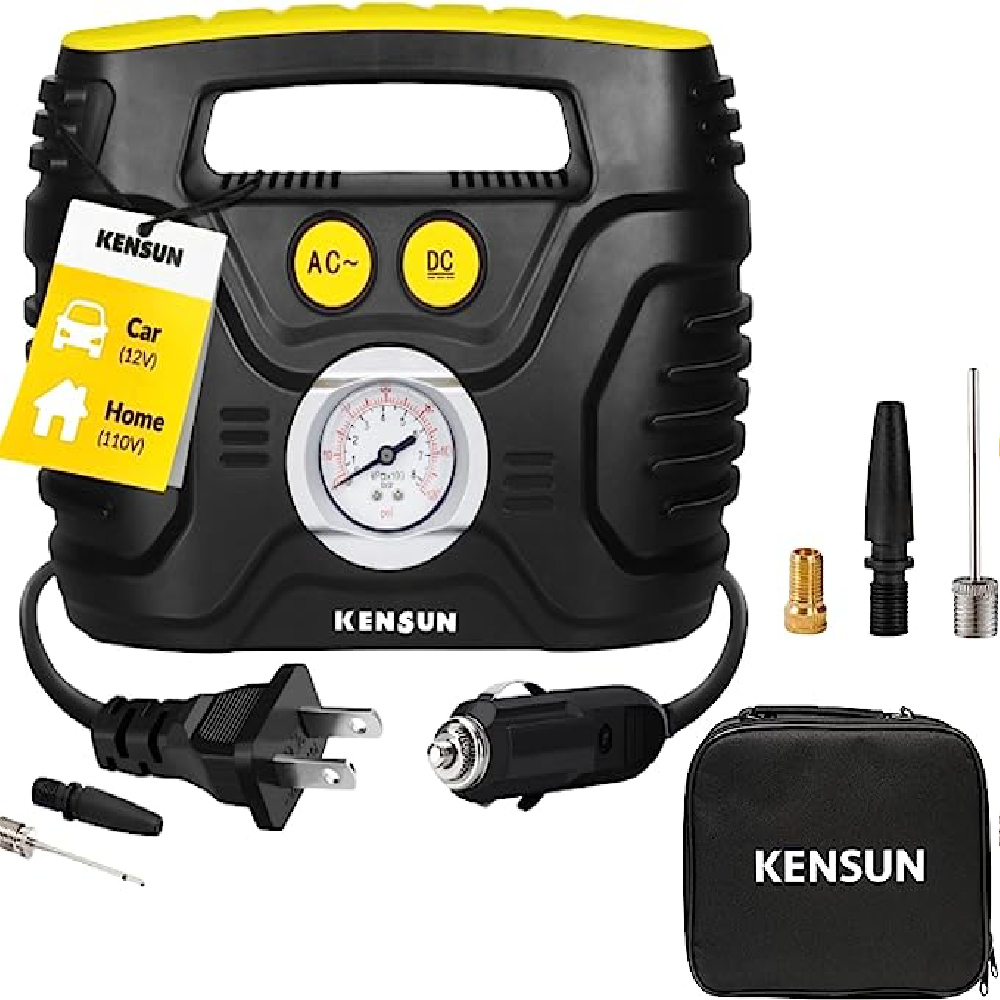 A black and yellow portable air compressor with its accessories and a tire pressure gauge in the center