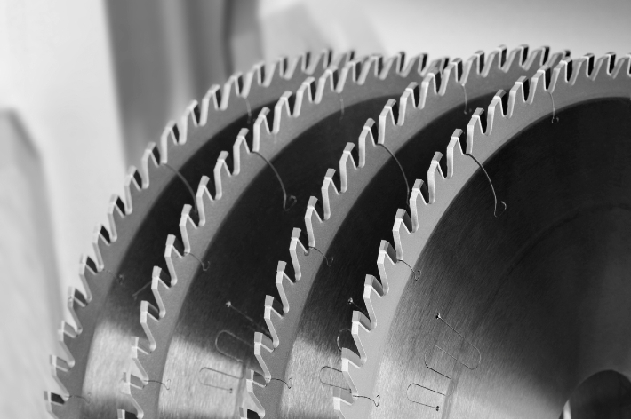 A picture of four oscillating saw blades.
